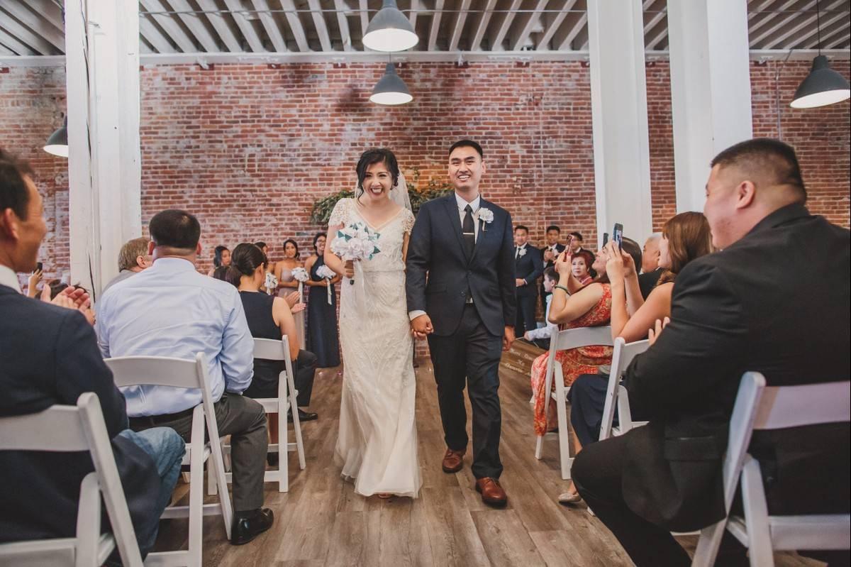 wedding recessional in indoor industrial space