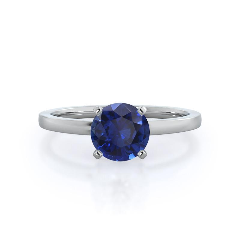 Sapphire solitaire engagement ring with white gold band