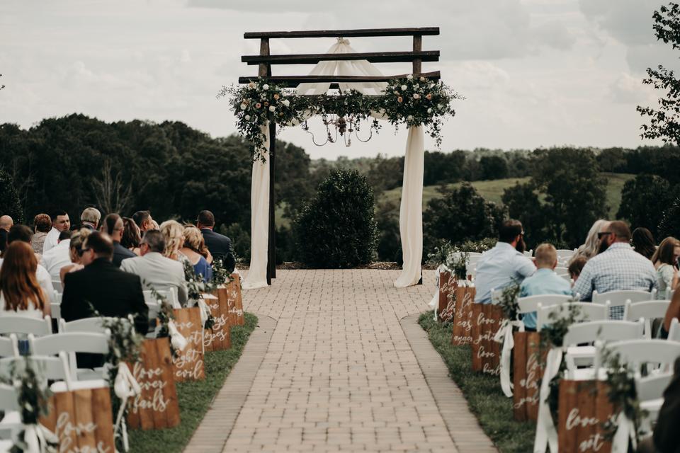 outdoor wedding aisle decor idea wooden aisle markers with 1 Corinthians 13:4-8 bible verse