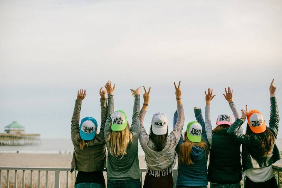 bridesmaids wearing matching hats