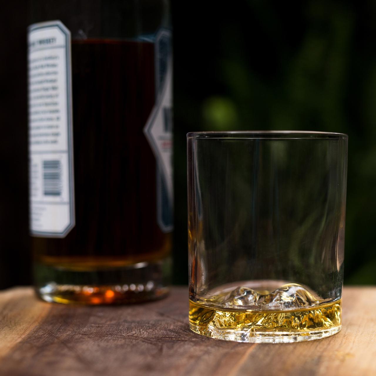 Handblown whiskey glass with mountain peak at bottom cool fifth anniversary gift for husband or wife