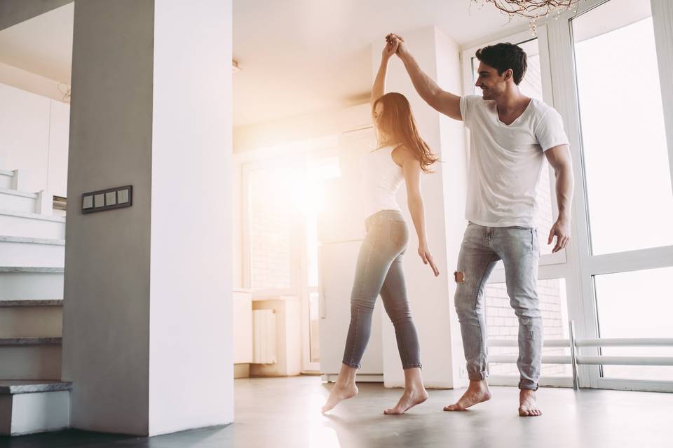 couple dancing in house