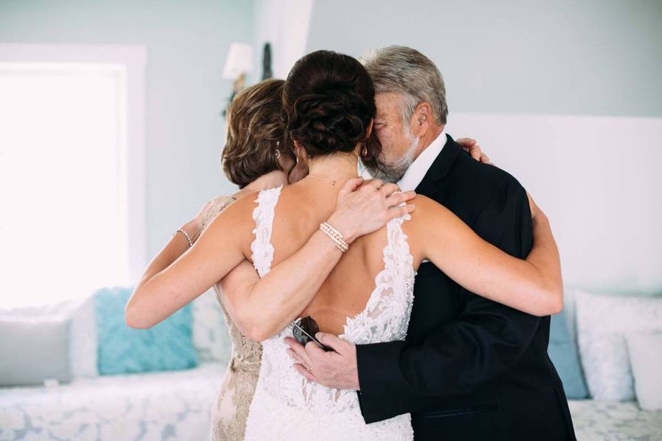 bride hugging her parents