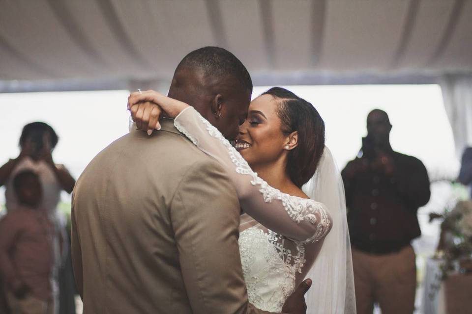 bride and groom performing first dance at wedding