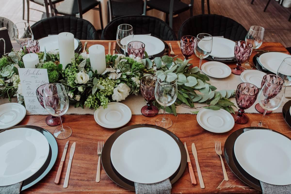 Wedding table arranged with golden cutlery and white charger plate. Mockup  for menu, invitation card, festive concept in vintage style Stock Photo