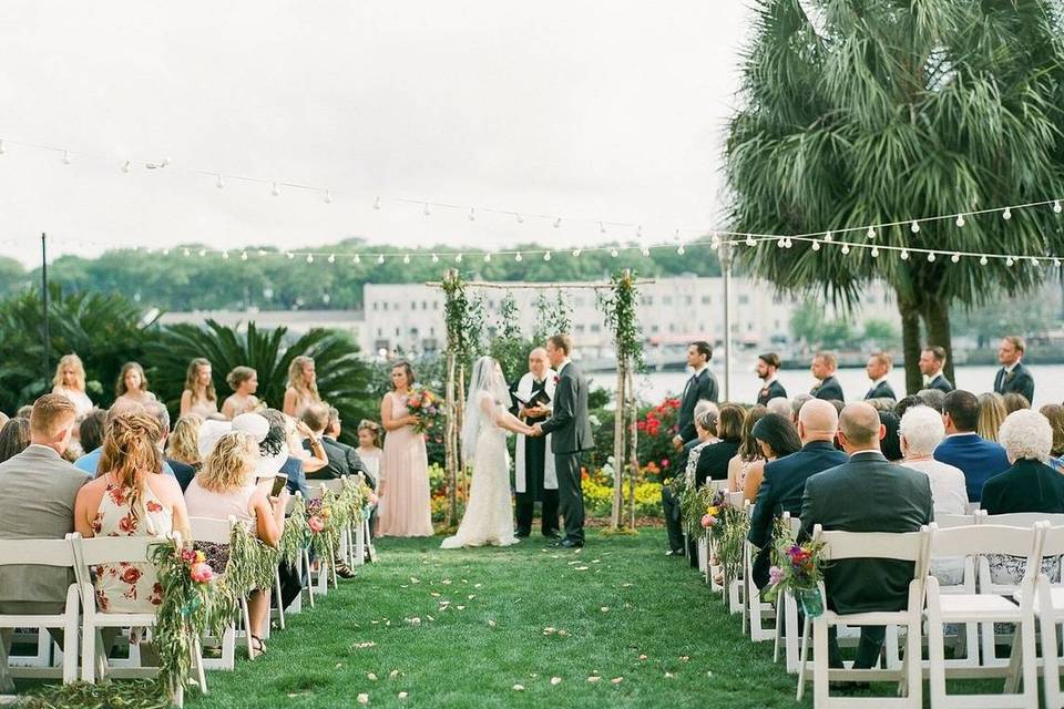 couple stand at the altar at the westin savannah harbor