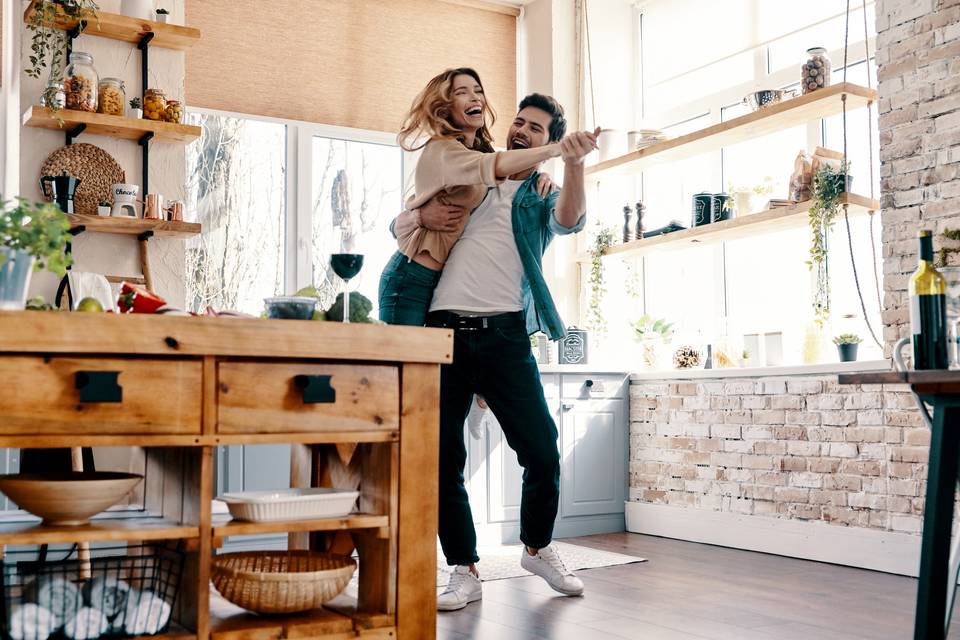 couple dancing in kitchen