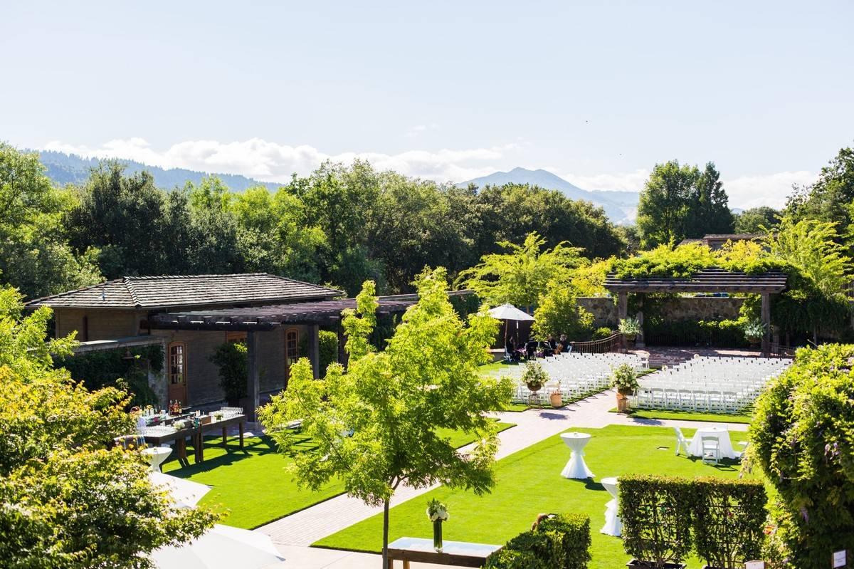 aerial view of napa wedding venue green lawn sunny day with wooden pavilion surrounded by trees
