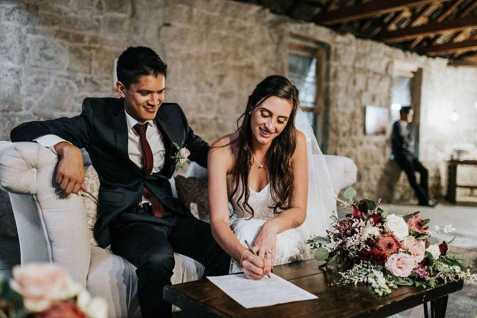 couple signing marriage license