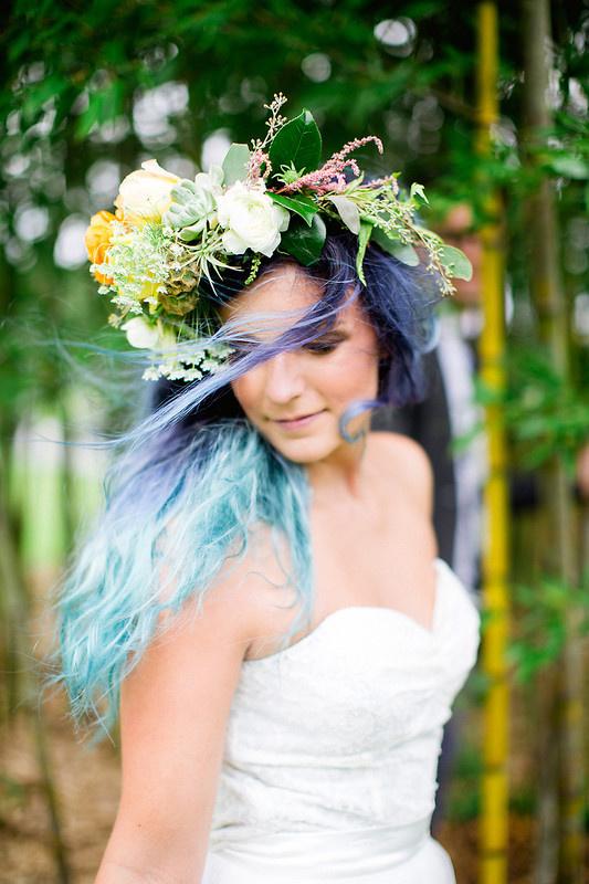 bride with teal and navy blue ombre hair wearing a greenery and yellow flower crown