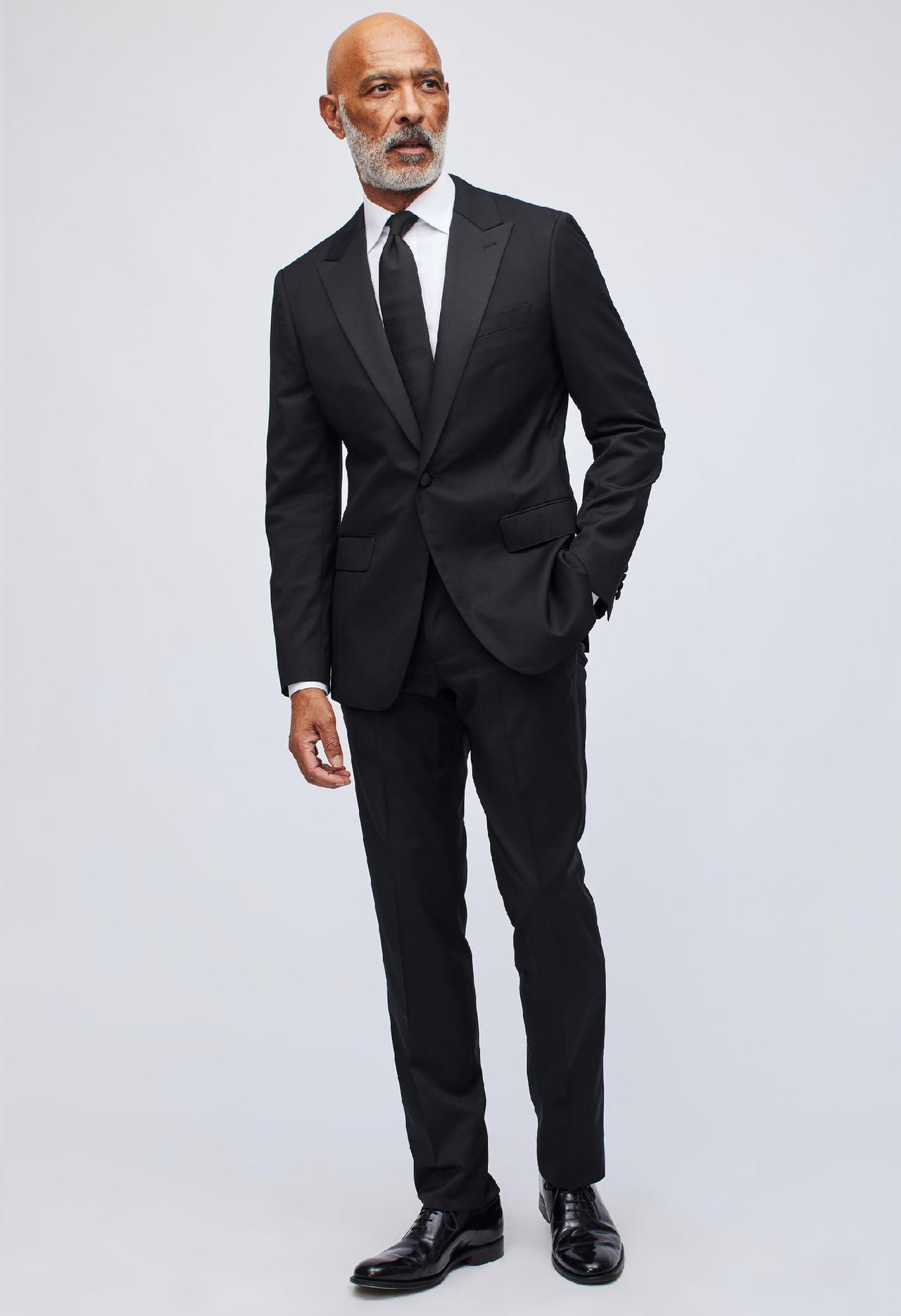 Can a man wear black suit to a wedding best sale