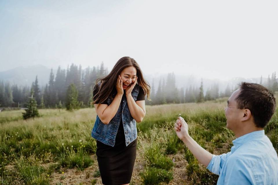 man proposing to surprised woman