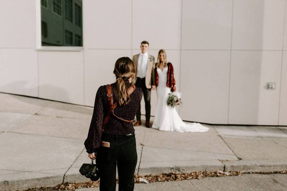 wedding photographer taking photos of couple