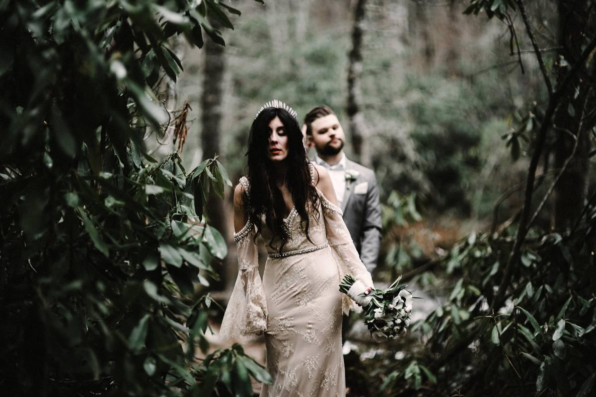 halloween themed wedding idea goth bride wearing lace gown with crystal tiara