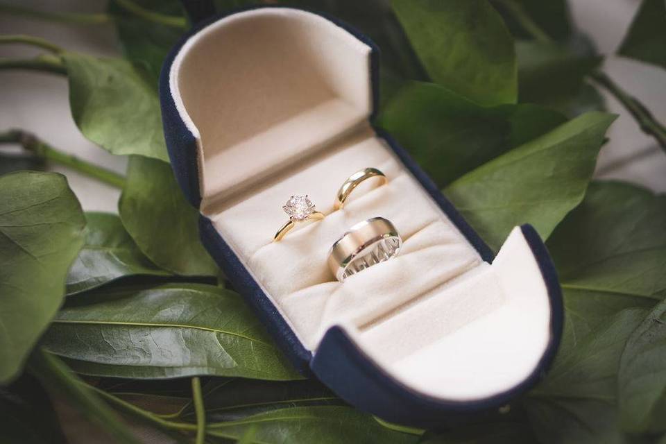 matching bridal engagement ring and wedding ring set in box with groom's wedding ring