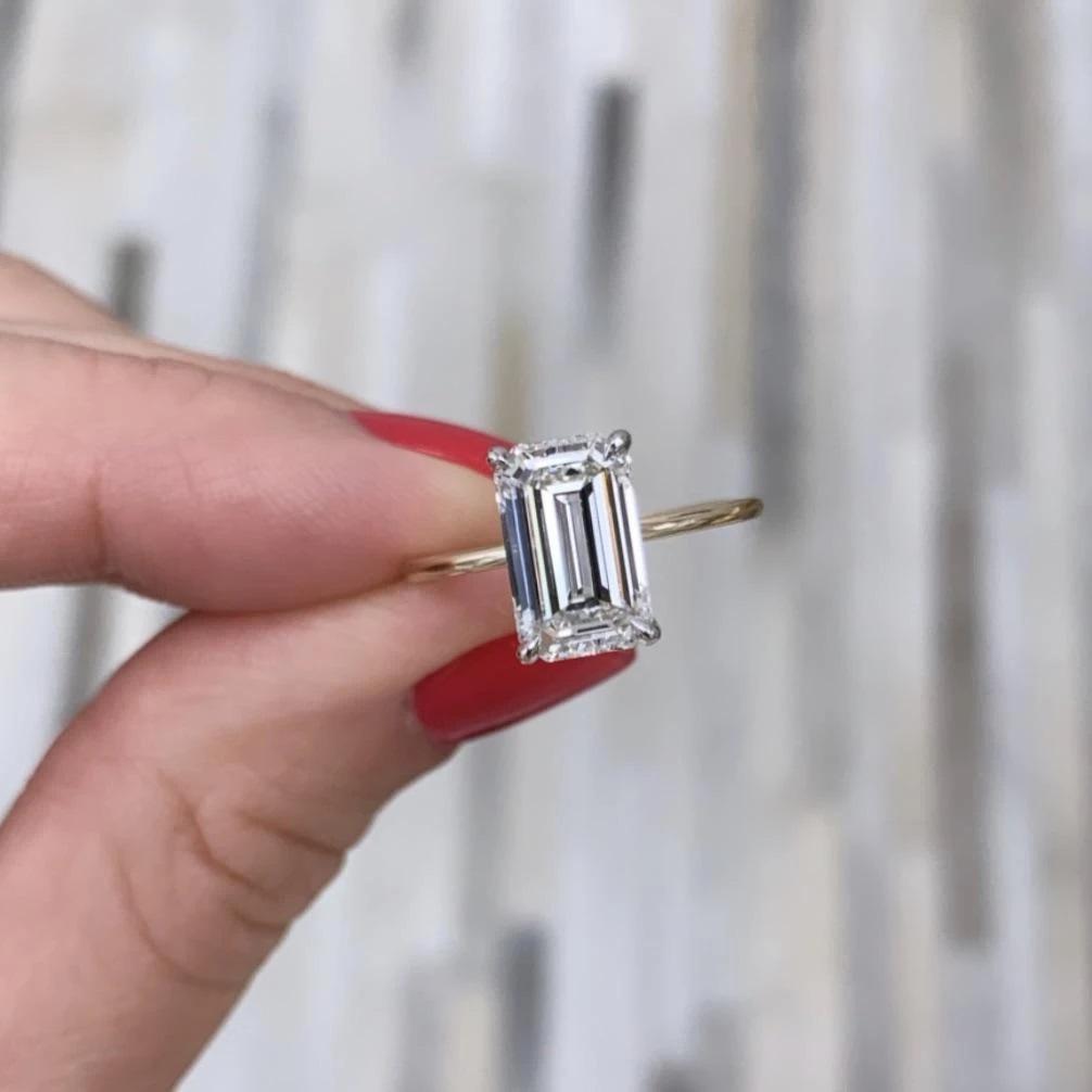 Stunning emerald-cut diamond on thin yellow gold band