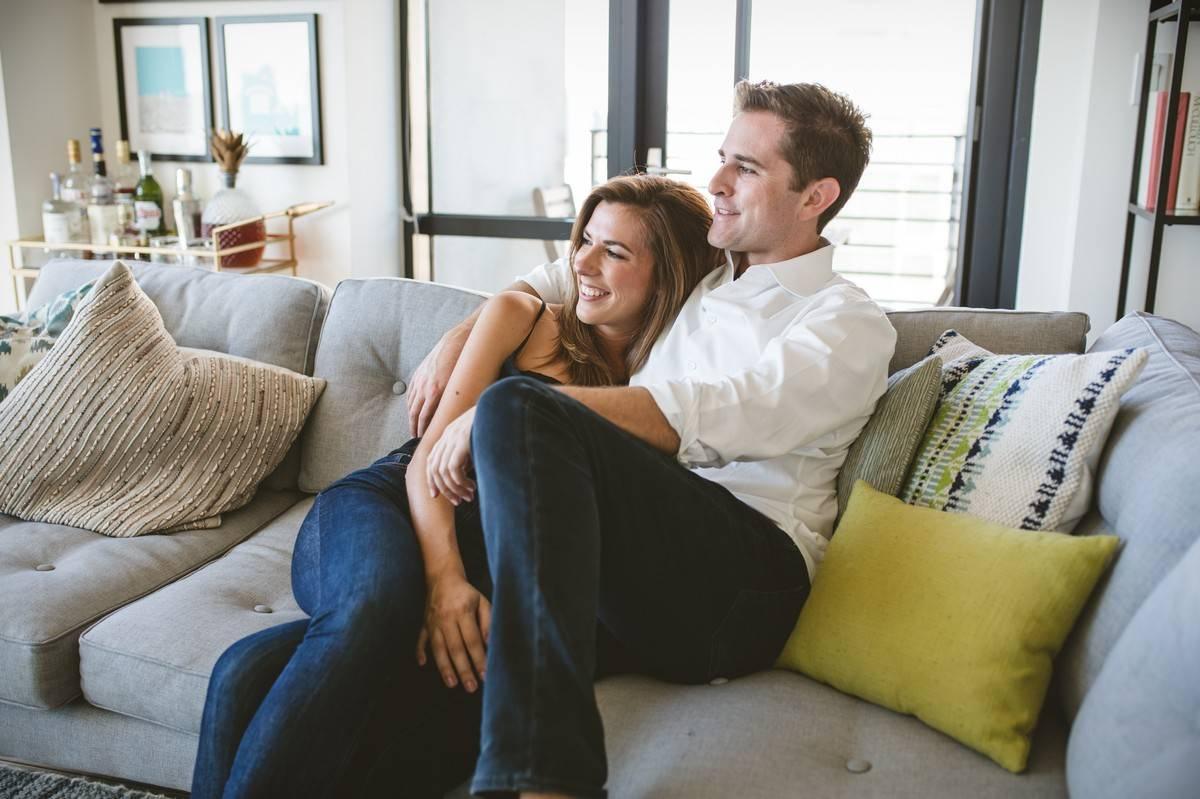 couple watching movie on couch