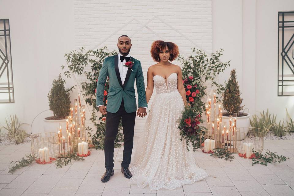 stylish bride and groom holding hands