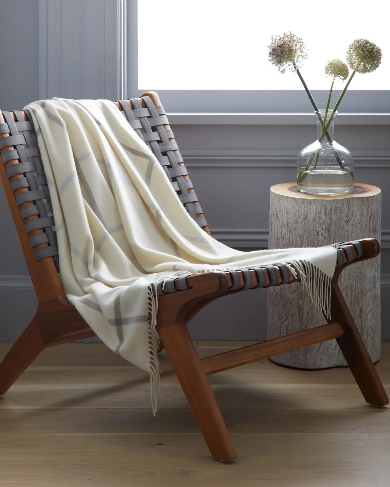 cozy cashmere throw hanging over armchair