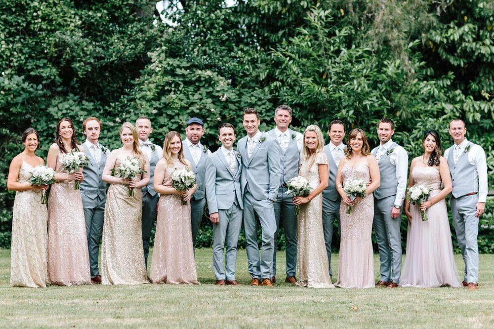 Wedding party photo with bridesmaids wearing neutral champagne and pale pink dresses