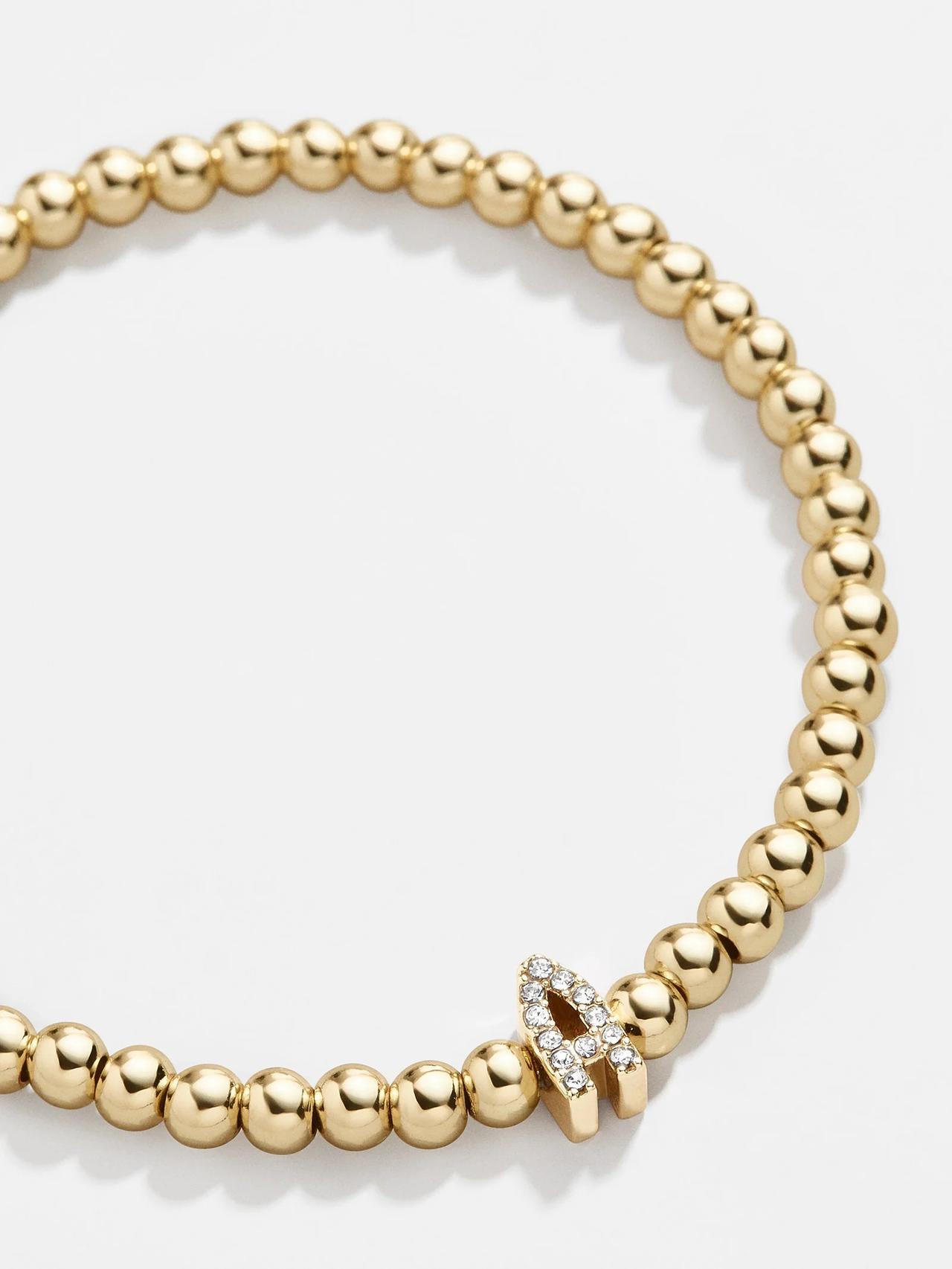 gold beaded bracelet with pave initial