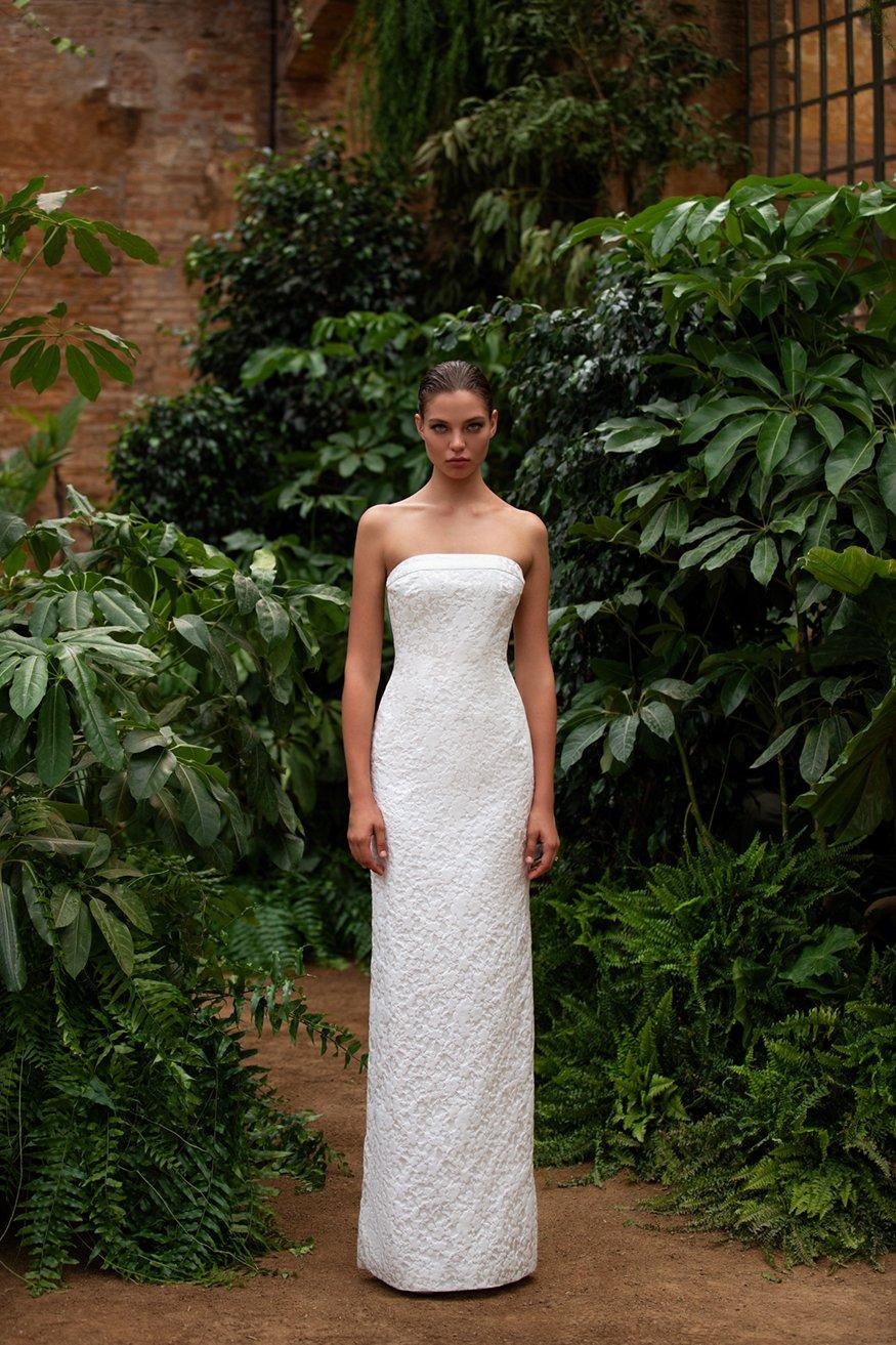 Simple and sophisticated white strapless wedding dress with full a