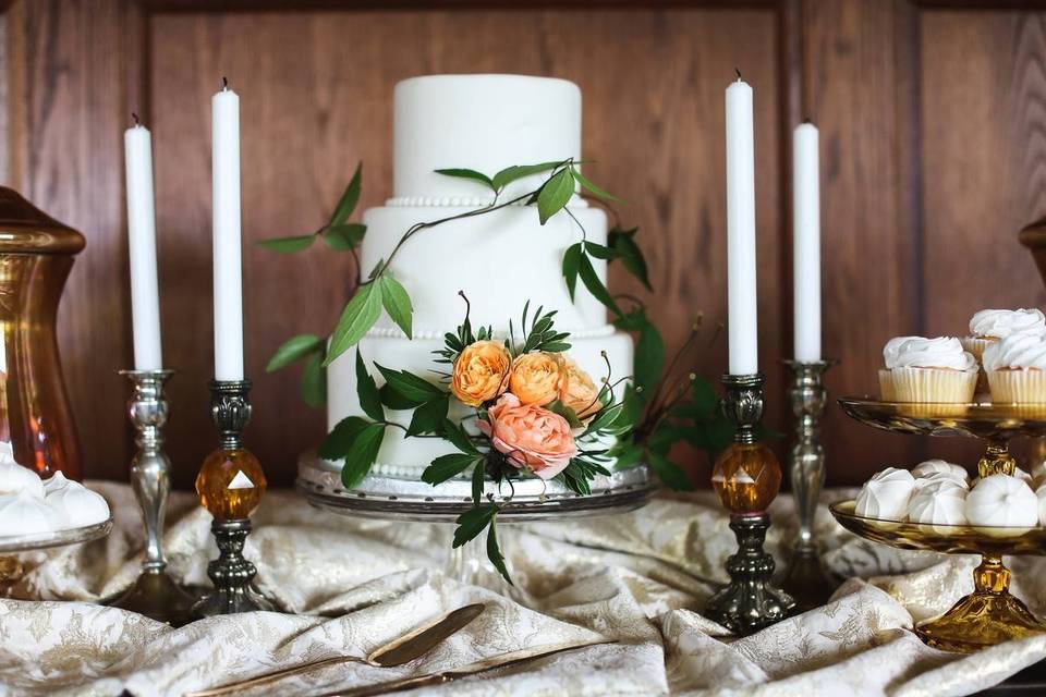 three tier wedding cake with pink and orange flowers