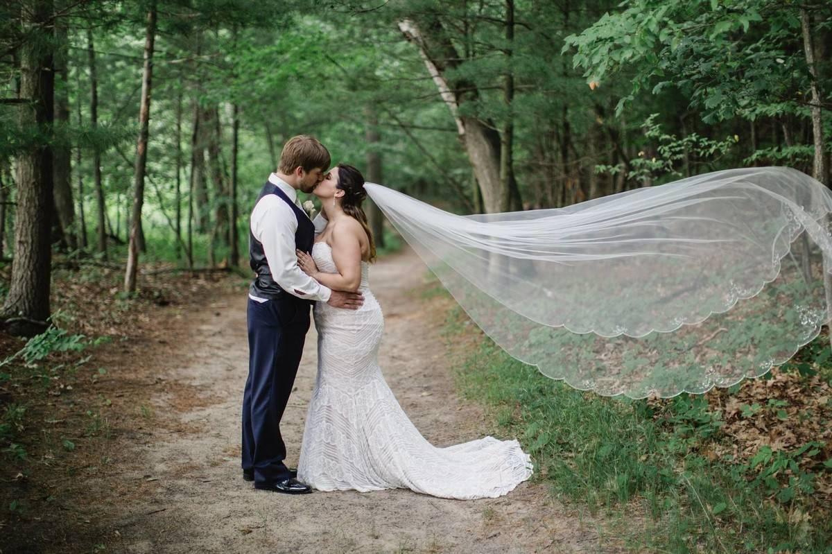 wedding groom and bride with flowing veil