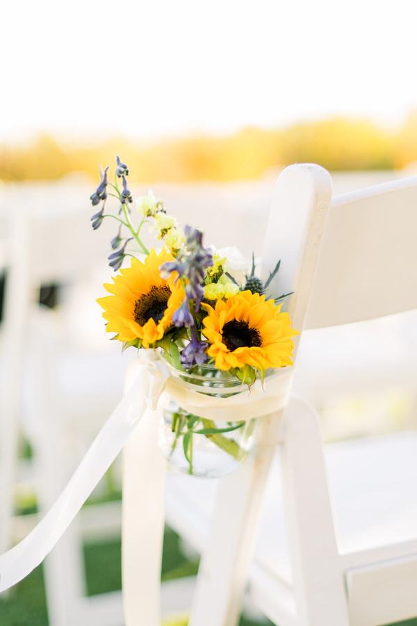 sunflower wedding aisle markers in mason jars with delphinium