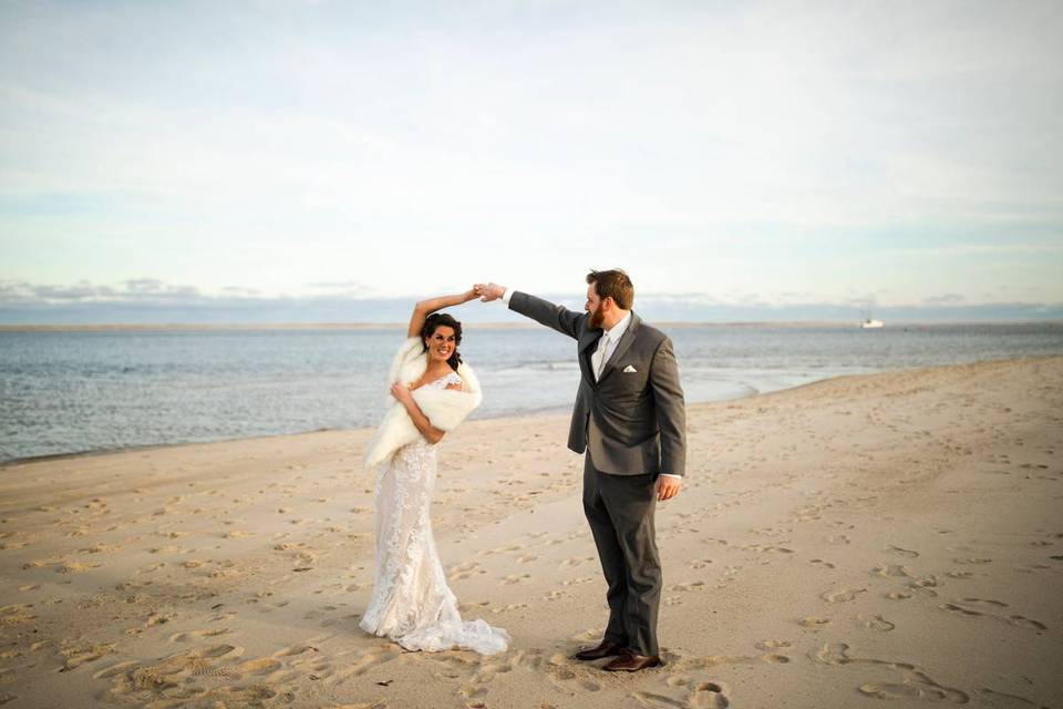 bride and groom dancing on the beach