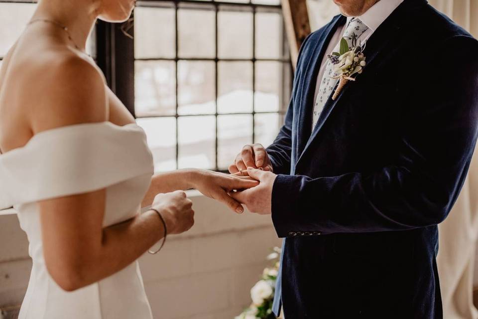 couple exchanging wedding rings