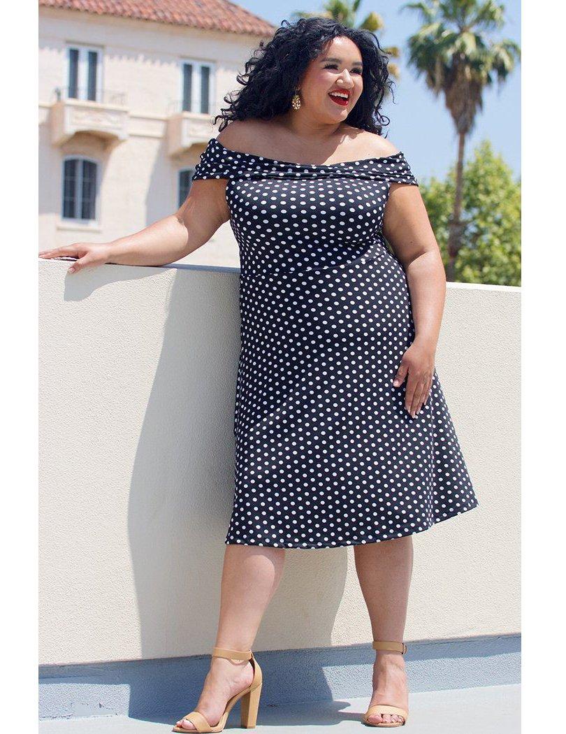 Black and white 1950s-inspired polka-dot fall wedding guest dress