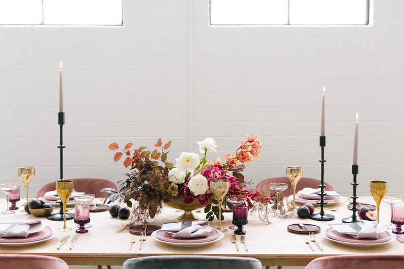 modern wedding centerpiece with fall leaves and white flowers