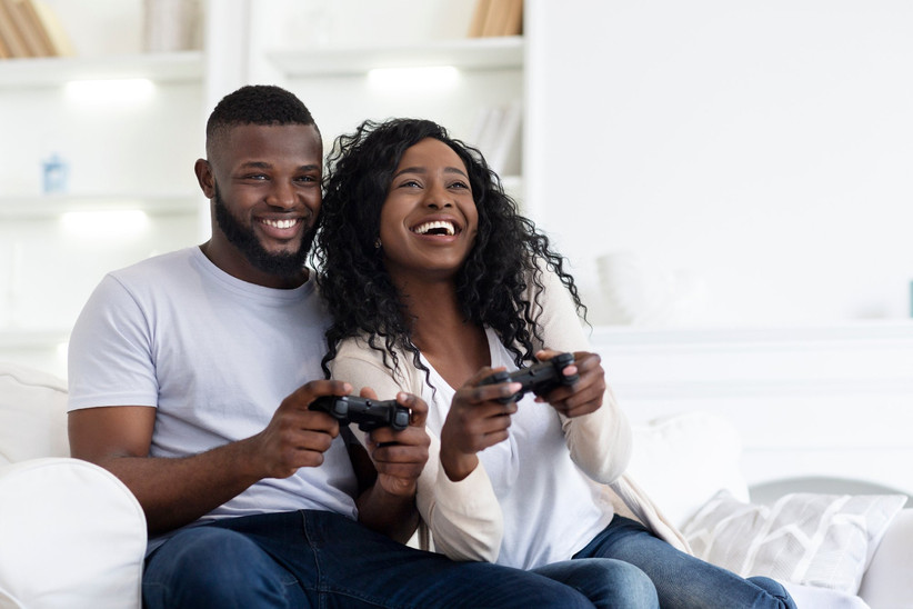 He enjoy playing. Two Happy African American couple. Two Happy African American couple Solid background.