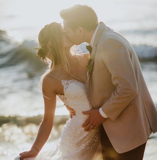 Groom kissing his bride