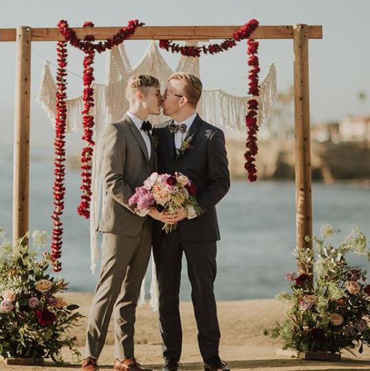 Grooms kissing