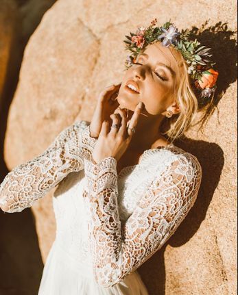 Sleeved lace wedding gown and flower crown