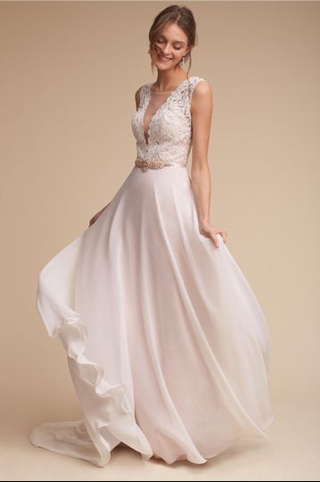 BHLDN Taryn Gown		Delicate lace traverses the bodice of this romantic gown, framing a dramatic...
