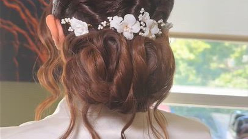 Voluminous Low Bun with Floral Accessory
