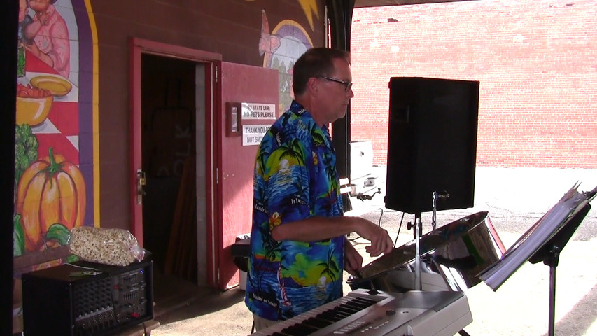 Tropical shores playing at hutchinson farmers market 