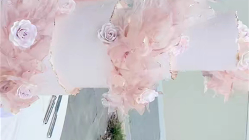 Dusty rose pink wedding cake with rice paper art