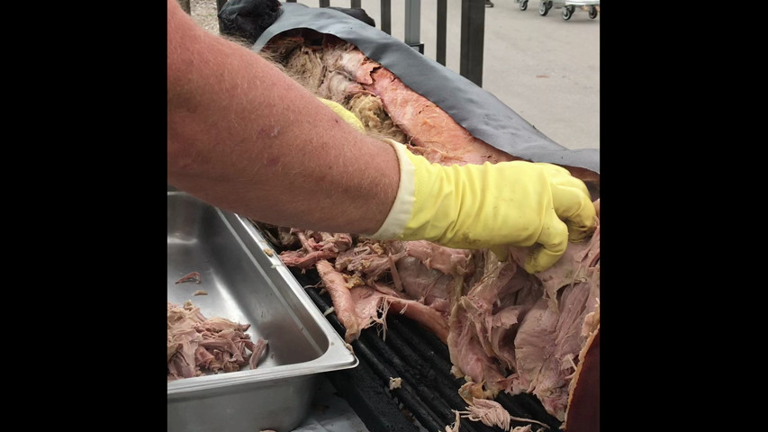 Carving a roasted pig