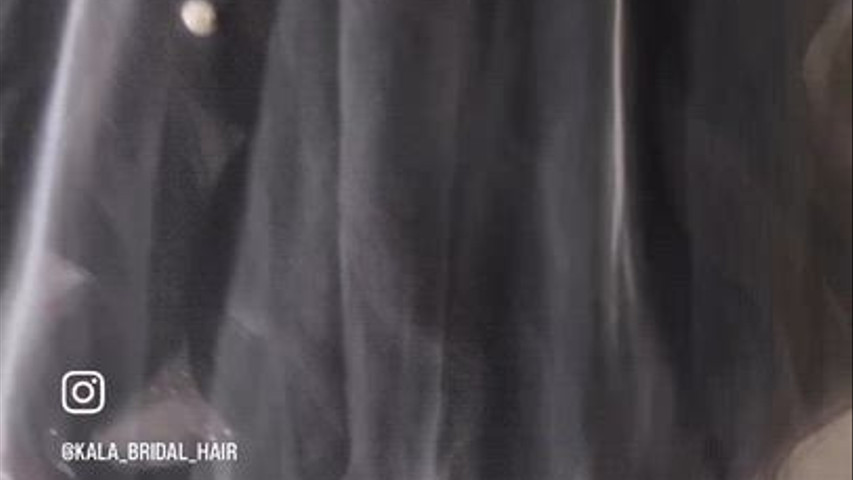 Soft curl under veil