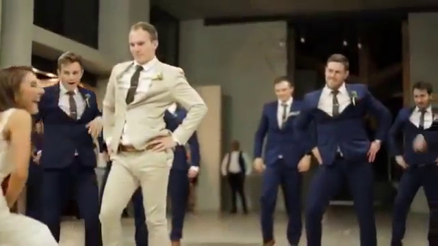 Groom surprises bride with epic groomsmen dance