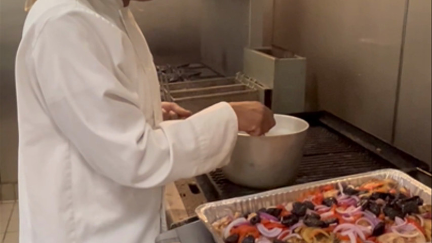 Chef Alexis cooking Chicken Marbella