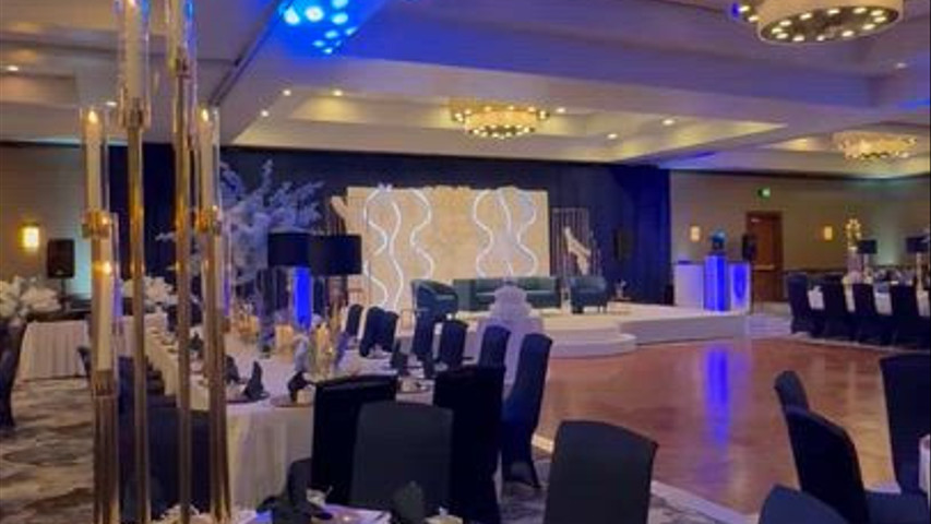 Grand Ballroom - Ivory/Blue Linens with Gold Accents and Stage