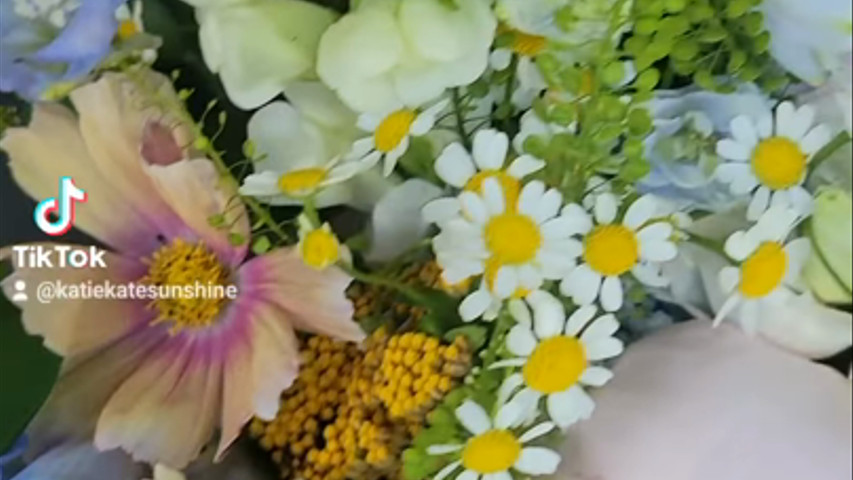 Blue, peach and orange wedding flowers