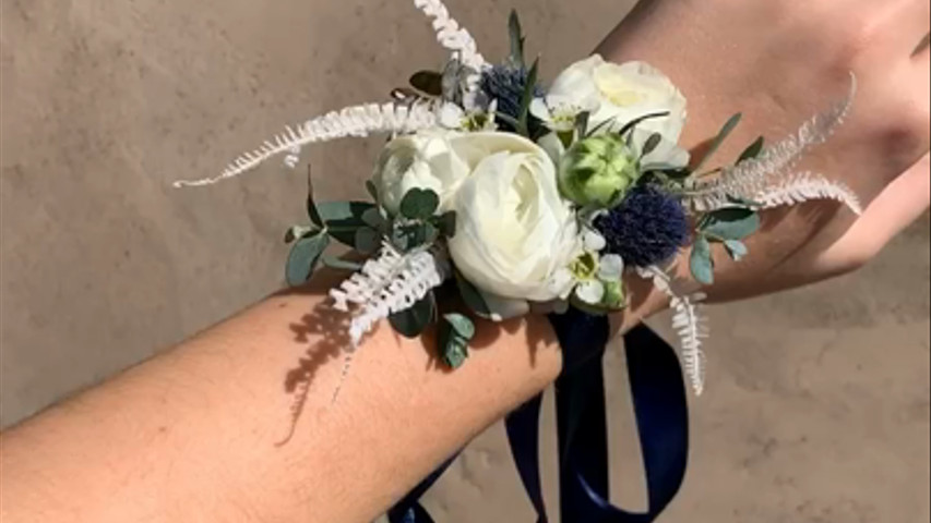 Blue Corsage with green accents  for a Junior Bridesmaid