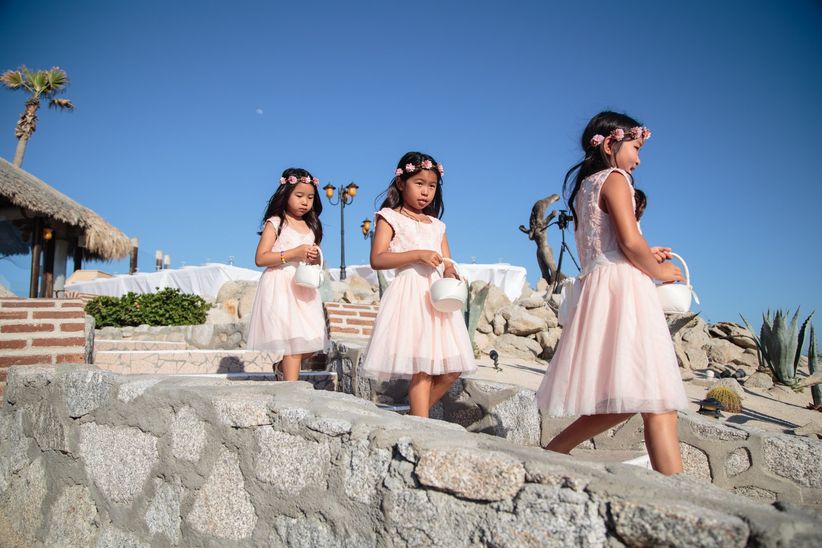 flower girls walking down the aisle