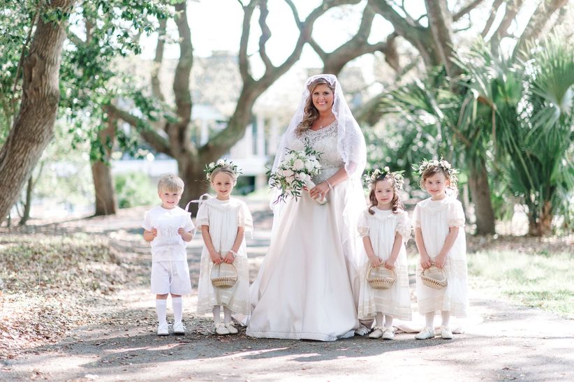 Classic Wedding Bride Posed with Flower Girls and Ring Bearer 